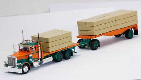 peterbilt 388 day cab with flatbed and lumber load in in orange and green 090002 Модель 1:53
