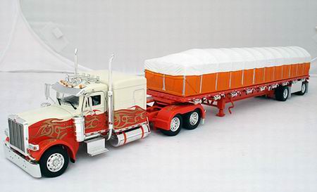Модель 1:53 Peterbilt 388 with 63 Flat top Sleeper with 48~ Flatbed with Covered Wagon - Cab in Orange and Cream with Gold Flame Detail