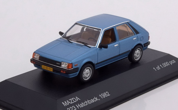 mazda 323 hatchback - blue met WB209 Модель 1:43